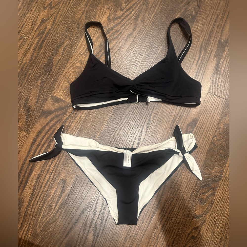 Black/ white string bikini size medium. Solid and striped.